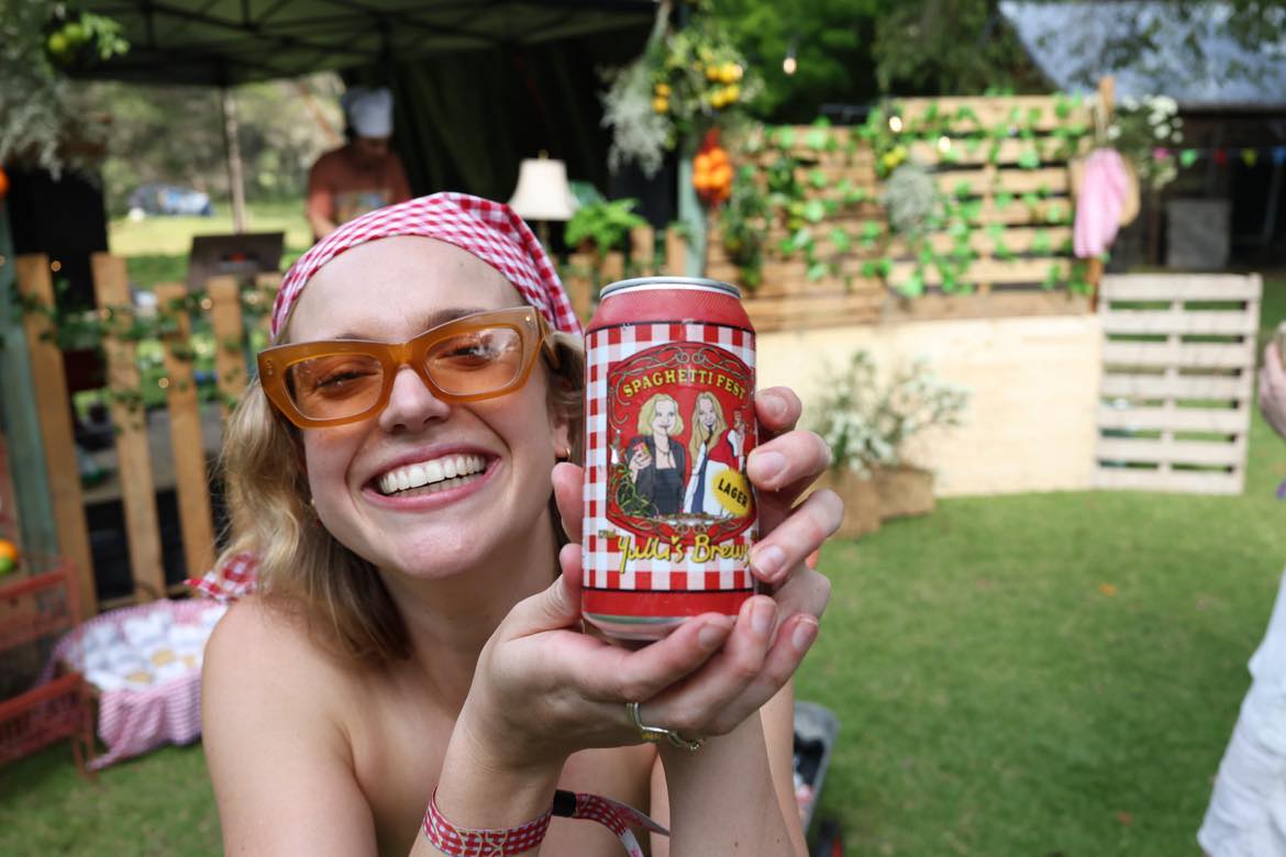 Custom beer can in hand